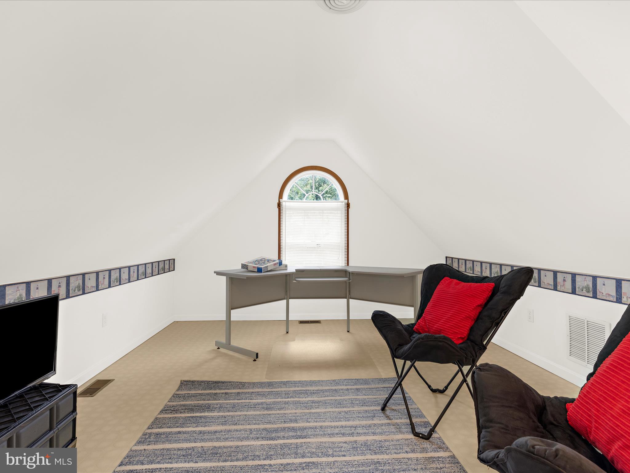 100 Marlborough Road Queenstown, MD 21658 - Photo 39 of 83 a view of a bedroom with furniture and wooden floor