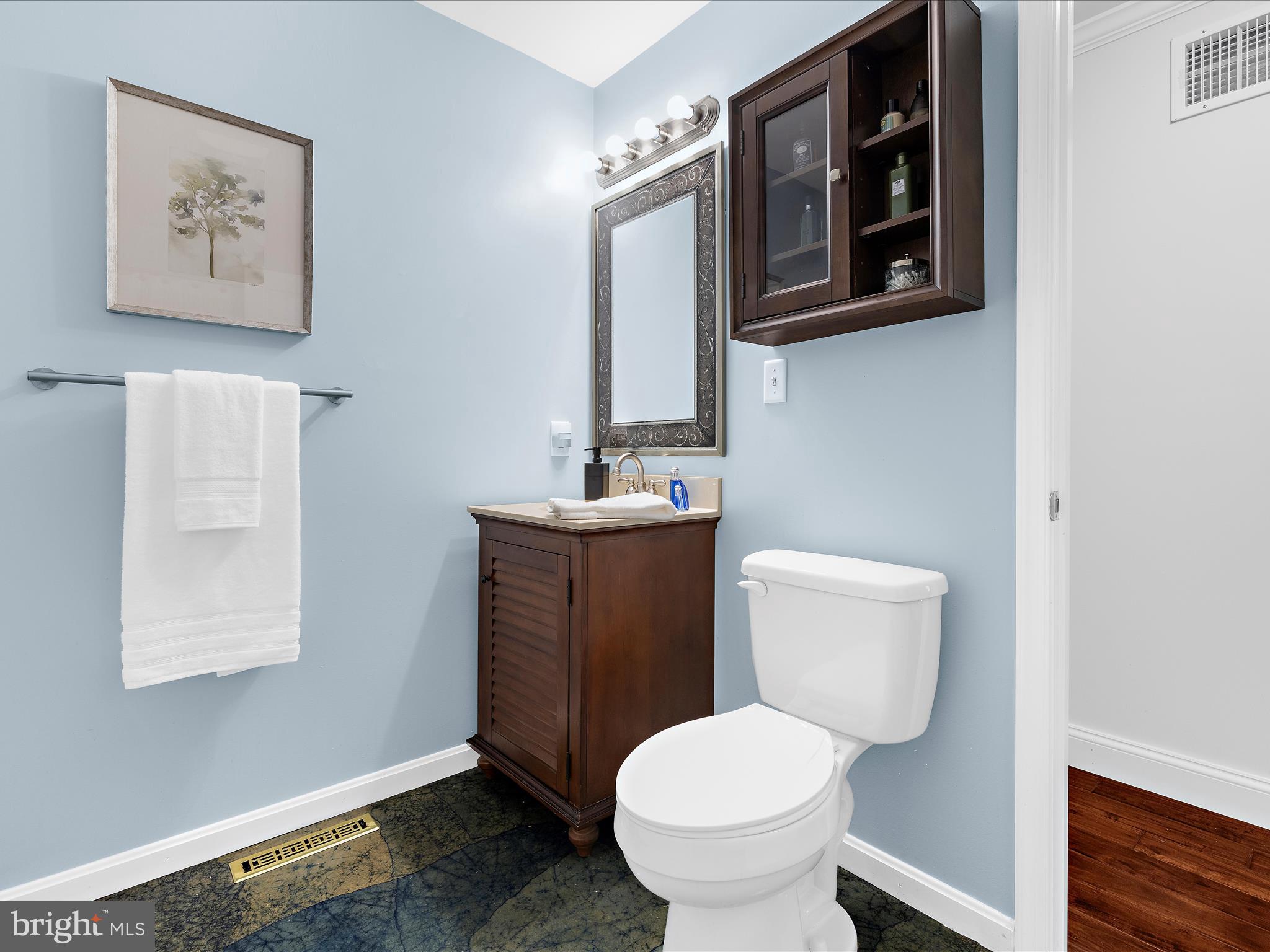 100 Marlborough Road Queenstown, MD 21658 - Photo 40 of 83 a bathroom with a toilet sink and mirror
