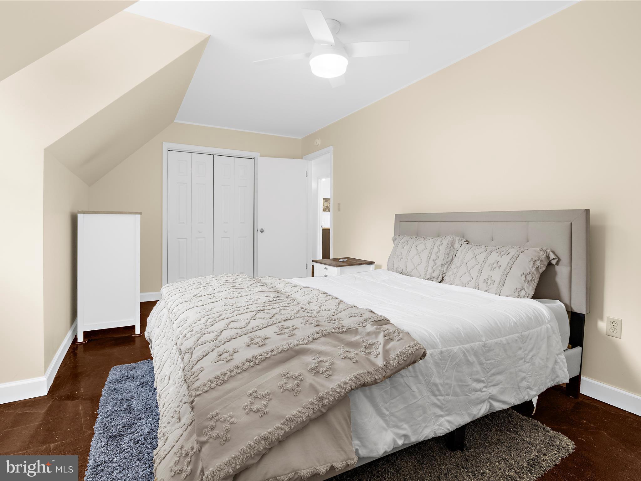 100 Marlborough Road Queenstown, MD 21658 - Photo 59 of 83 a bedroom with a bed and wooden floor