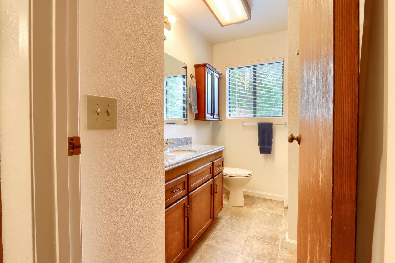 7430 Henness Ridge Road Yosemite National Park, CA 95389 - Photo 20 of 49 a bathroom with a sink a toilet and shower