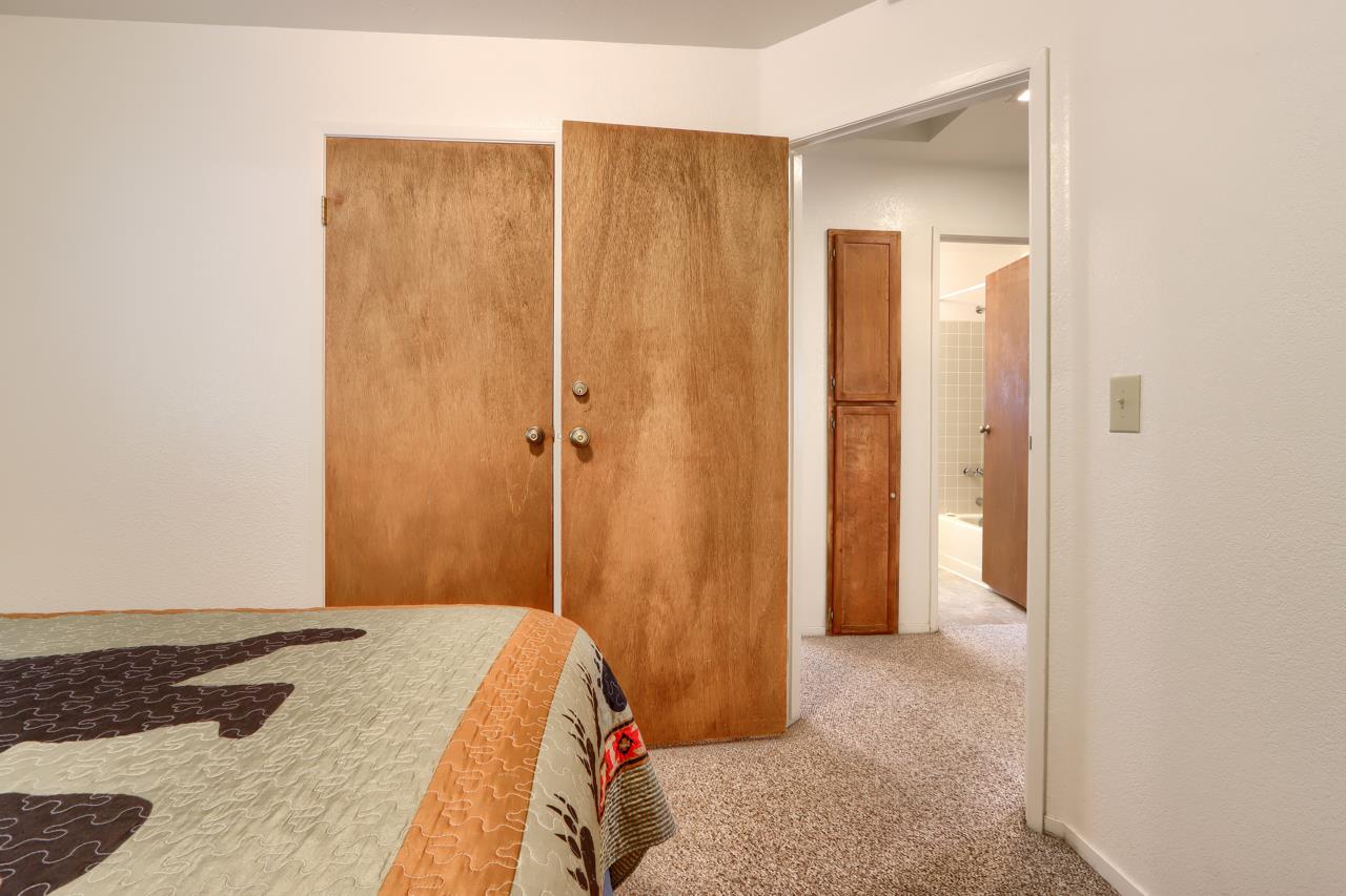 7430 Henness Ridge Road Yosemite National Park, CA 95389 - Photo 26 of 49 a bedroom with a bed and a shower