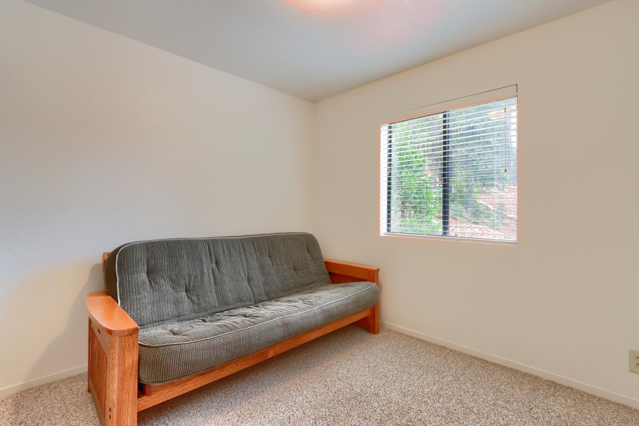 7430 Henness Ridge Road Yosemite National Park, CA 95389 - Photo 27 of 49 a living room with a couch and a window