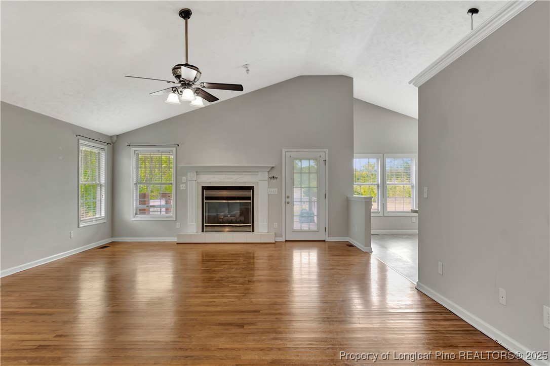 6036-6070 Camden Road Fayetteville, NC 28306 - Photo 11 of 45 a view of an empty room with window and wooden floor