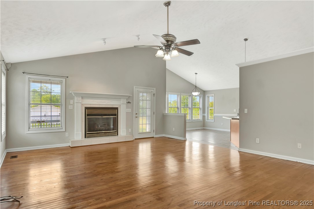 6036-6070 Camden Road Fayetteville, NC 28306 - Photo 12 of 45 a view of an empty room with window and wooden floor