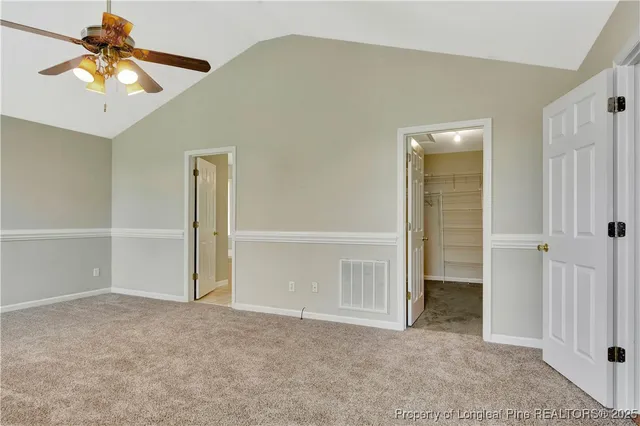 a spacious bathroom with a mirror a bathtub and shower
