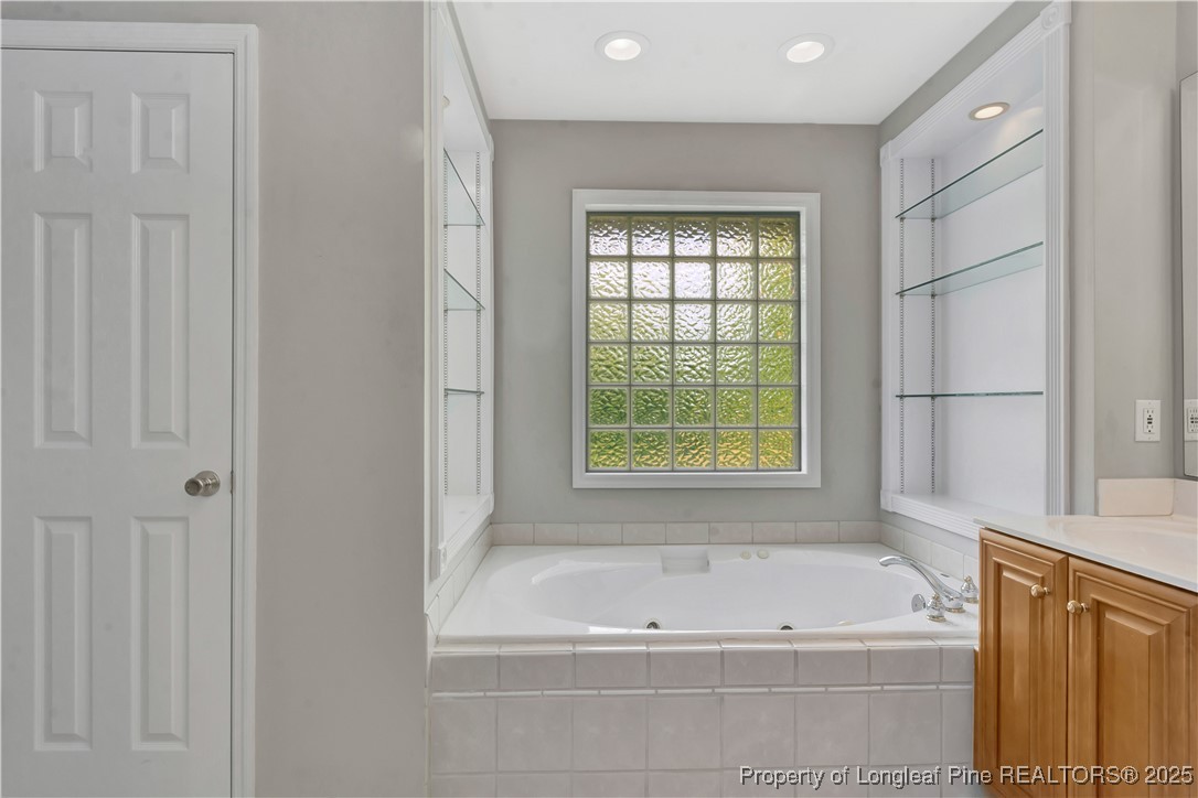 6036-6070 Camden Road Fayetteville, NC 28306 - Photo 28 of 45 a bathroom with bathtub and a window
