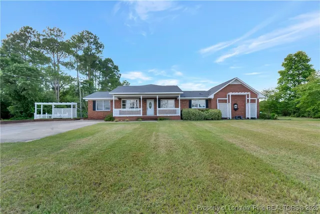 a front of a house with a garden