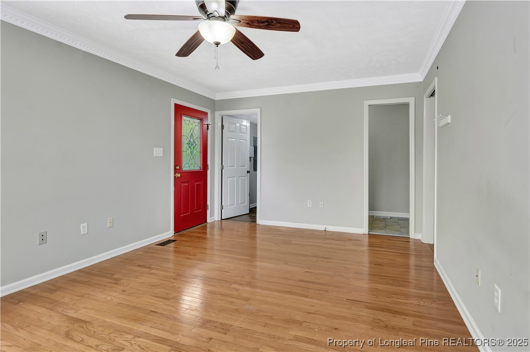 6036-6070 Camden Road Fayetteville, NC 28306 - Photo 36 of 45 an empty room with wooden floor and windows