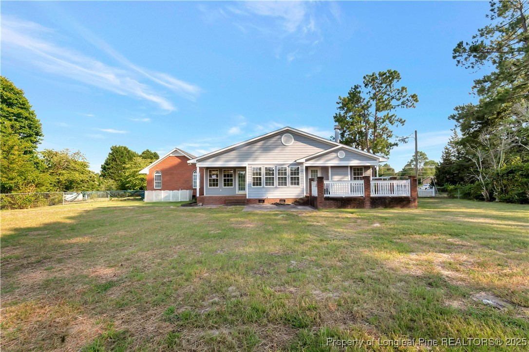 6036-6070 Camden Road Fayetteville, NC 28306 - Photo 40 of 45 a front view of a house with a garden