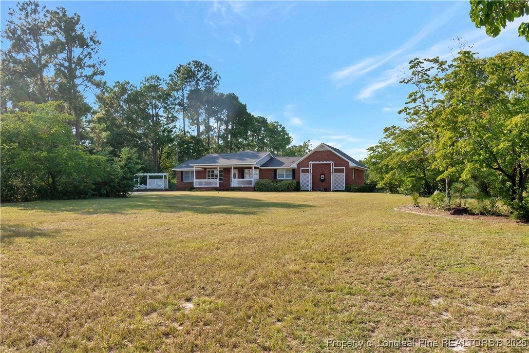 6036-6070 Camden Road Fayetteville, NC 28306 - Photo 45 of 45 a house view with swimming pool in front of it