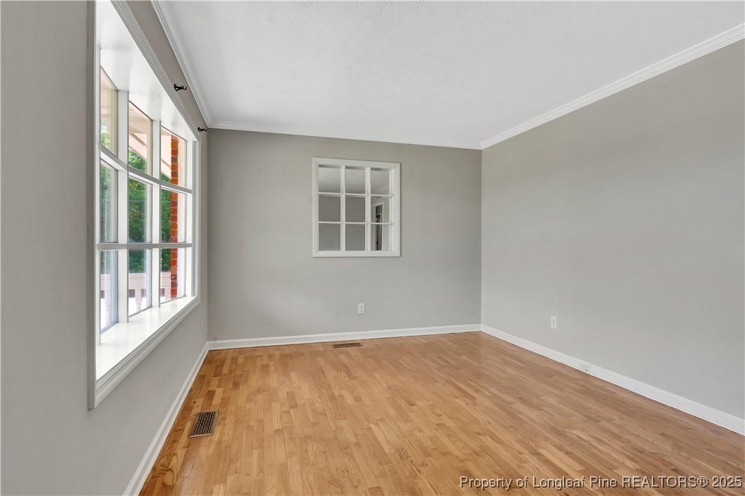 6036-6070 Camden Road Fayetteville, NC 28306 - Photo 8 of 45 an empty room with wooden floor and windows