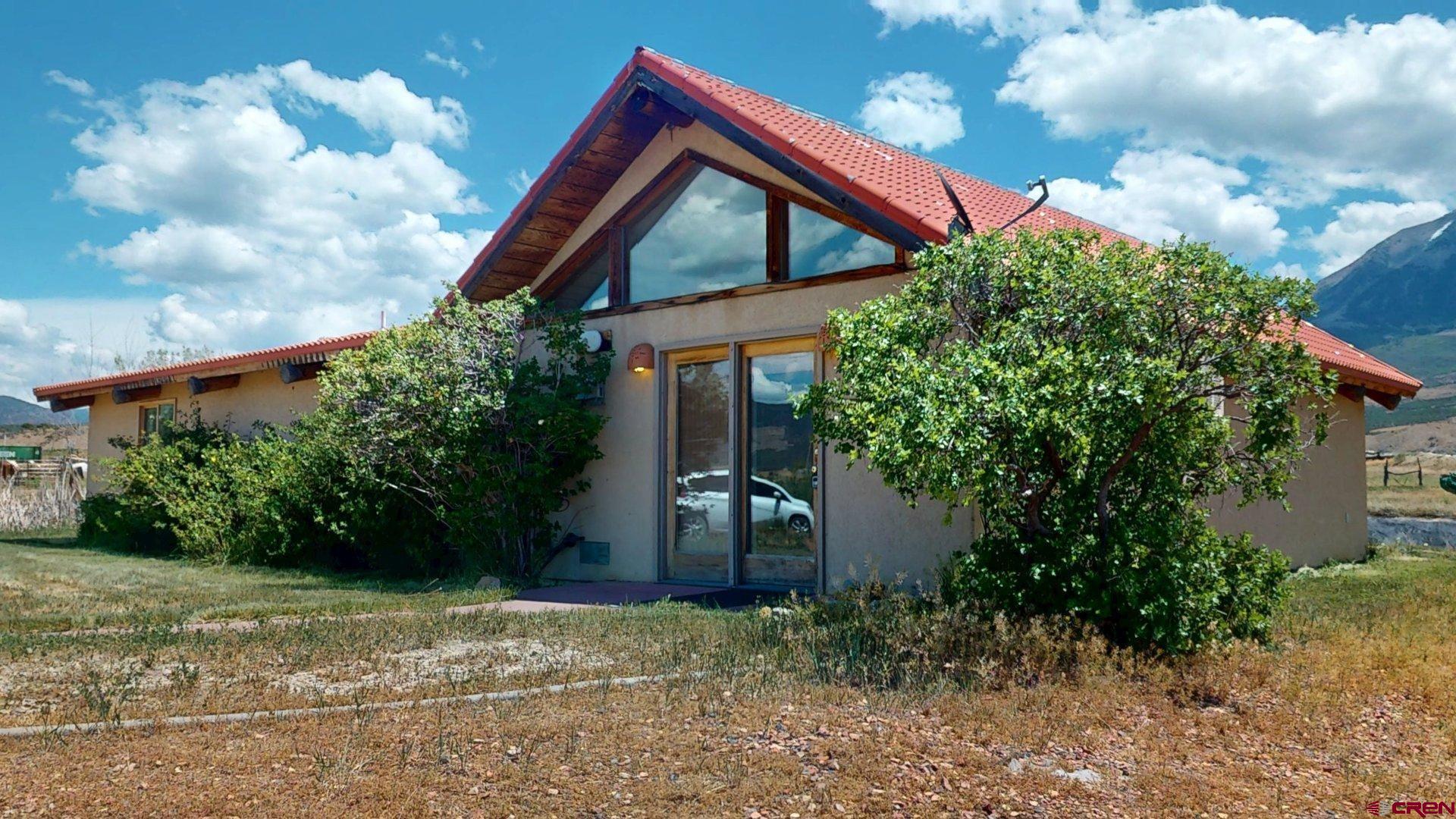40557 M75 Road Paonia, CO 81428 - Photo 33 of 34 a backyard of a house with lots of green space