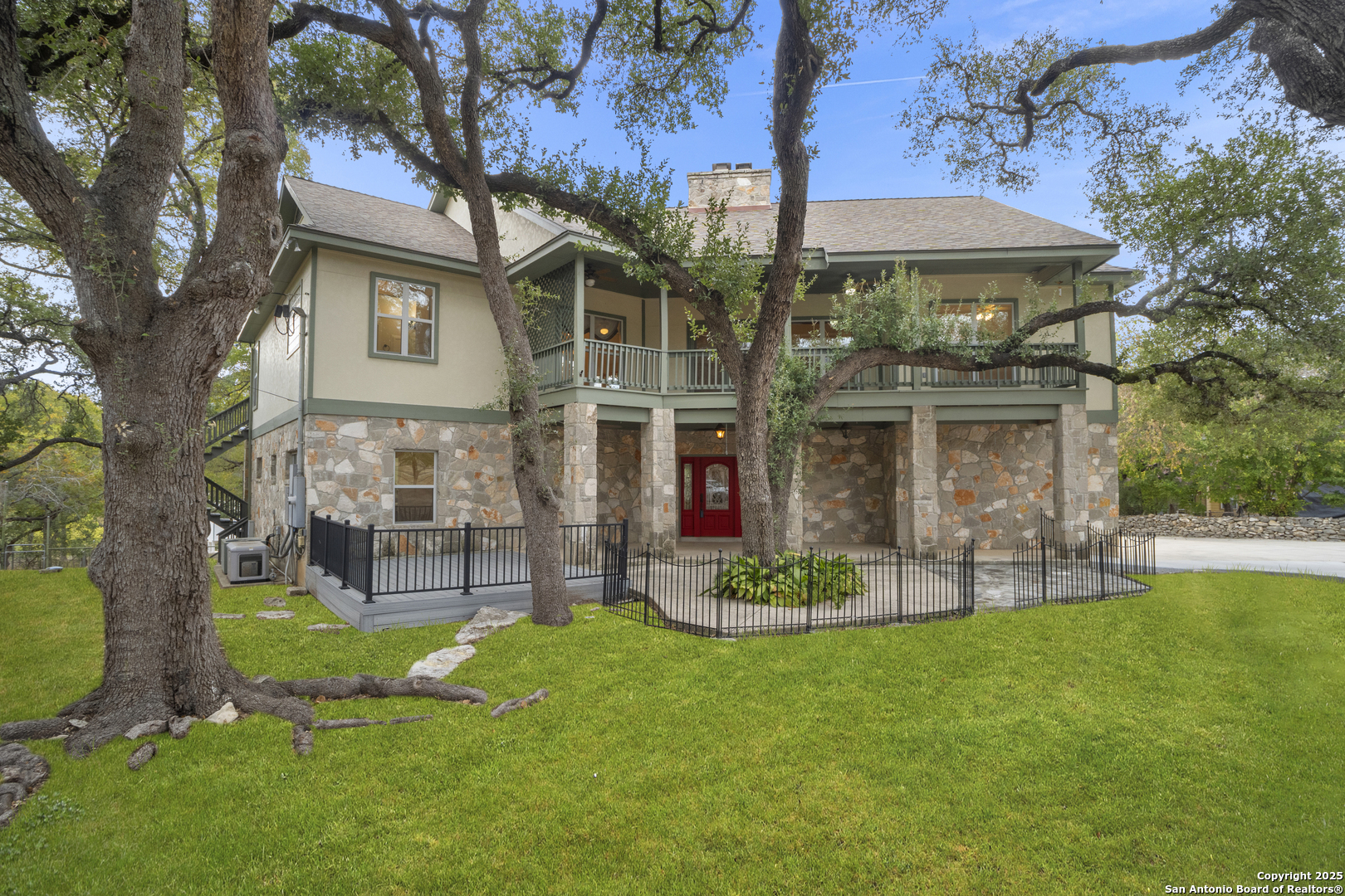1245 Phantom Rider Trail Spring Branch, TX 78070 - Photo 1 of 48 a view of a chair and table in backyard of the house