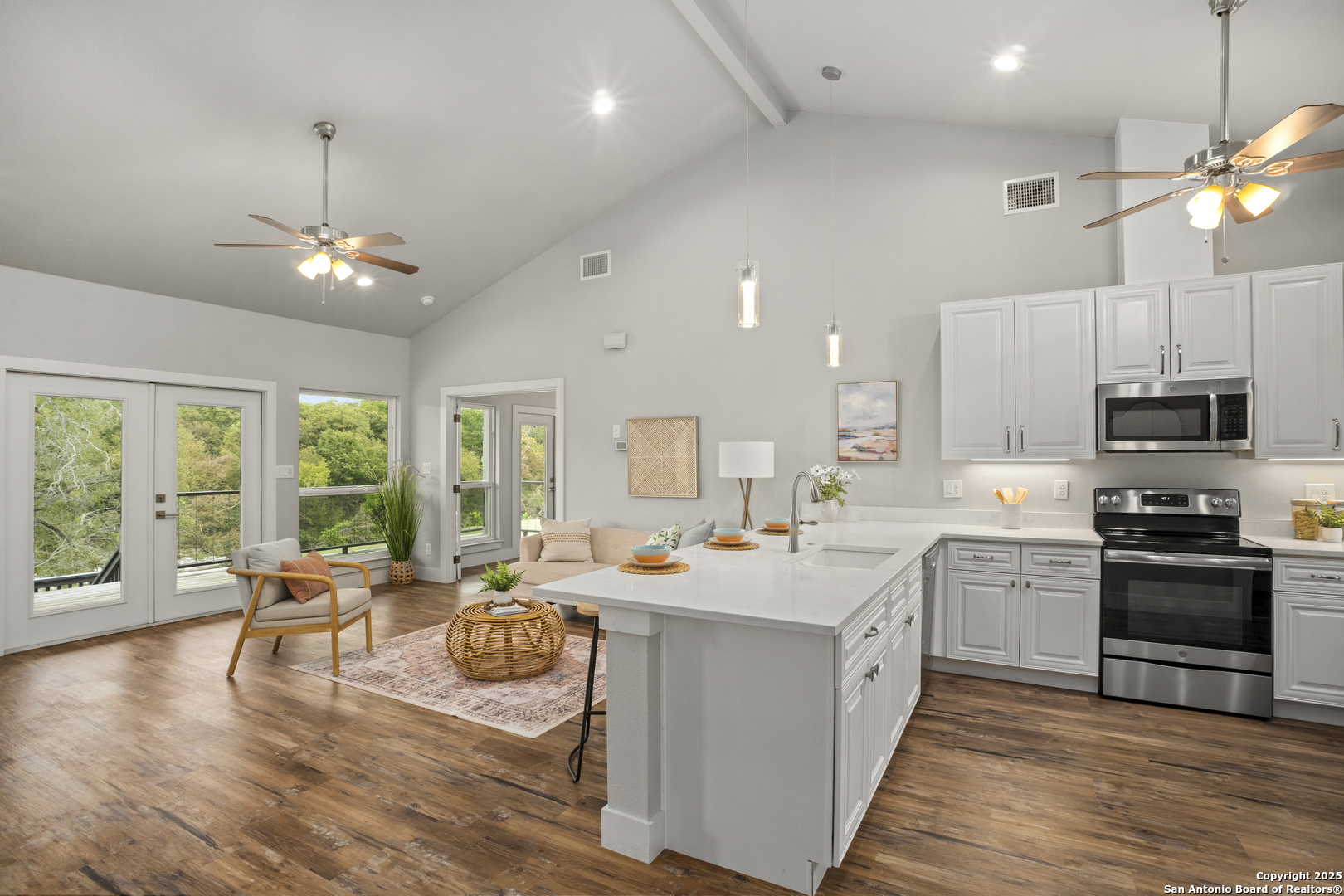 1245 Phantom Rider Trail Spring Branch, TX 78070 - Photo 12 of 51 a kitchen that has a lot of cabinets furniture and wooden floor