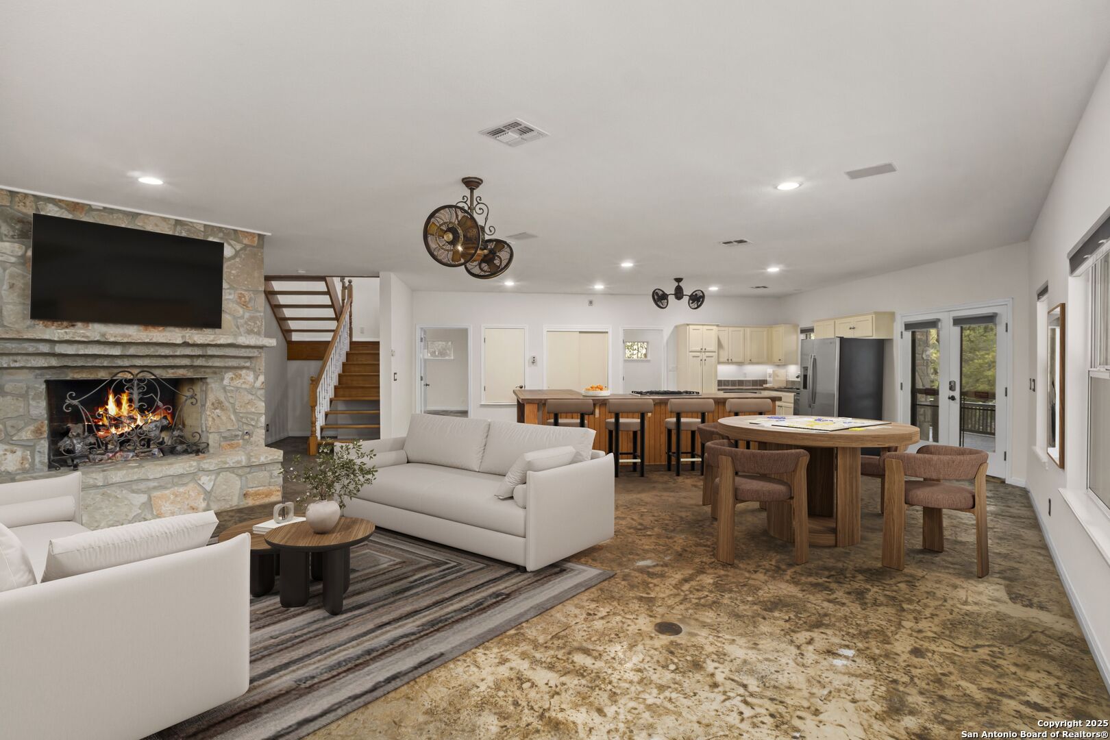 1245 Phantom Rider Trail Spring Branch, TX 78070 - Photo 15 of 48 a living room with furniture a flat screen tv and kitchen view
