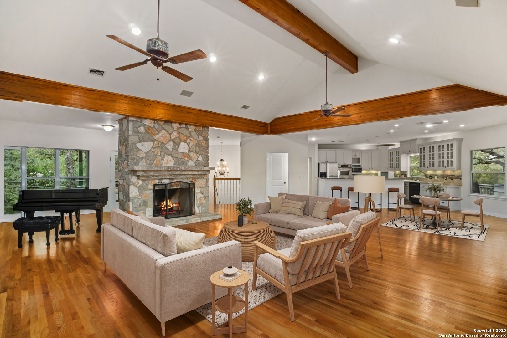 1245 Phantom Rider Trail Spring Branch, TX 78070 - Photo 2 of 48 a living room with fireplace furniture and a large window