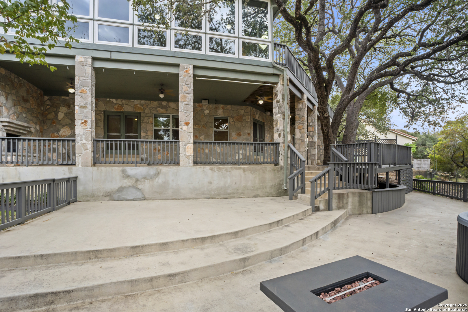 1245 Phantom Rider Trail Spring Branch, TX 78070 - Photo 23 of 48 a view of a building with a large tree