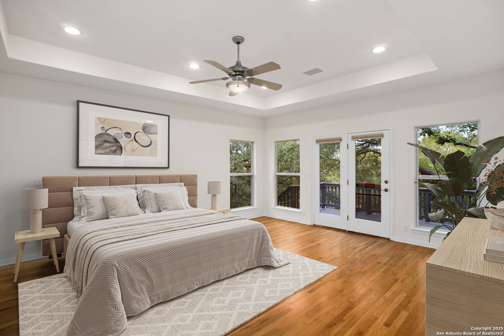 1245 Phantom Rider Trail Spring Branch, TX 78070 - Photo 28 of 51 a spacious bedroom with a large bed and a large window