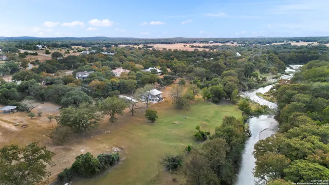 an aerial view of city and lake