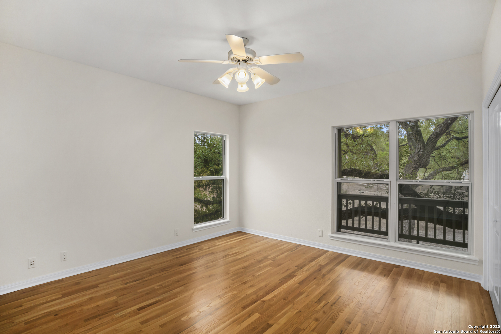 1245 Phantom Rider Trail Spring Branch, TX 78070 - Photo 31 of 51 wooden floor in an empty room with a window
