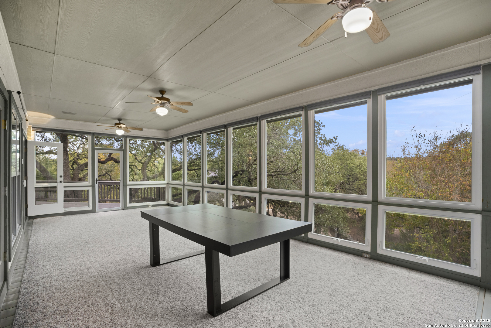 1245 Phantom Rider Trail Spring Branch, TX 78070 - Photo 35 of 51 a living room with furniture and a large window