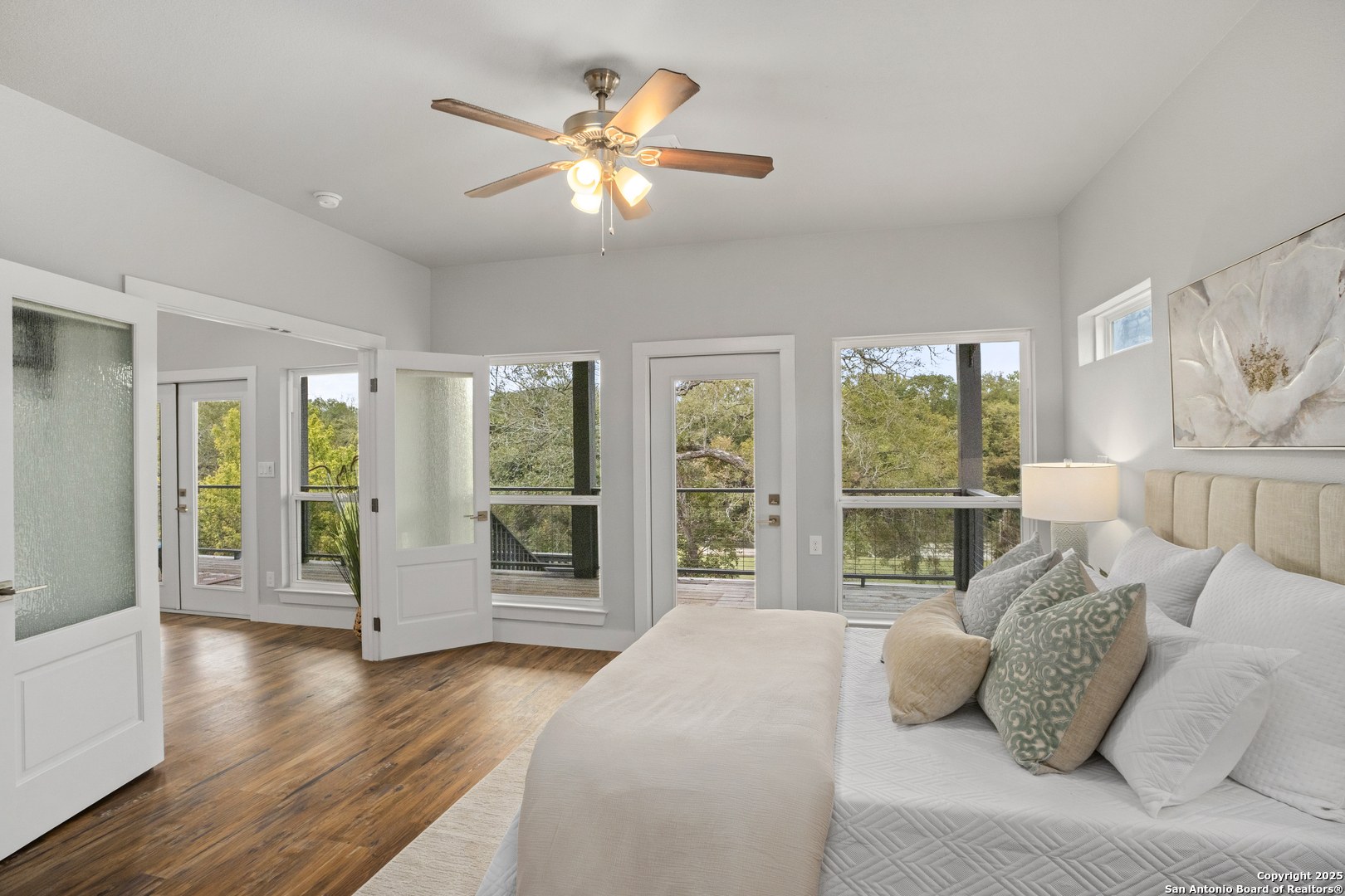 1245 Phantom Rider Trail Spring Branch, TX 78070 - Photo 35 of 48 a bedroom with a large bed and a large window