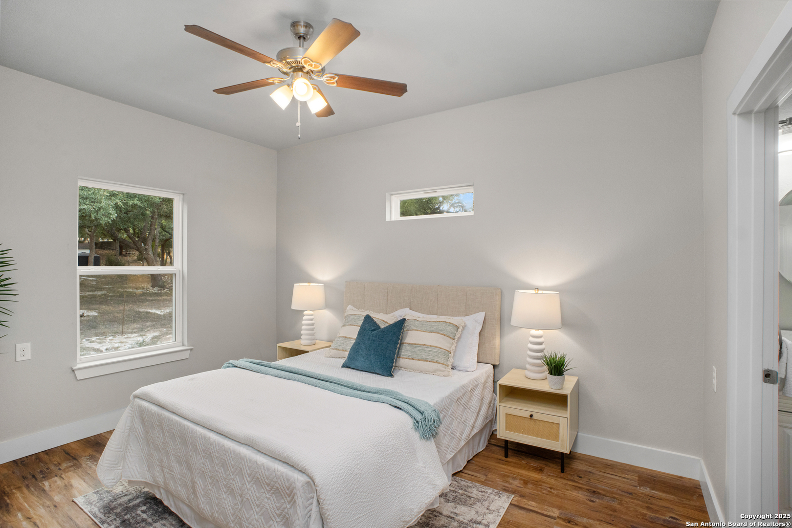 1245 Phantom Rider Trail Spring Branch, TX 78070 - Photo 39 of 48 a bedroom with a bed and a window