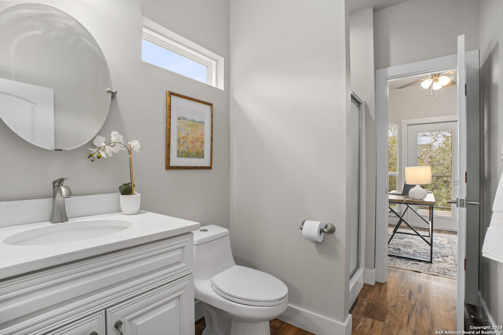 1245 Phantom Rider Trail Spring Branch, TX 78070 - Photo 40 of 48 a bathroom with a toilet a sink and mirror