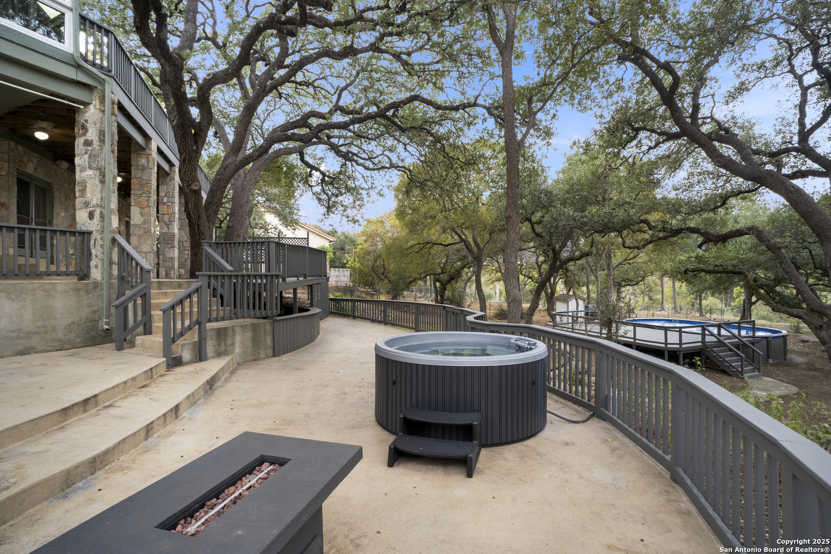 1245 Phantom Rider Trail Spring Branch, TX 78070 - Photo 46 of 51 a swimming pool with outdoor seating and yard