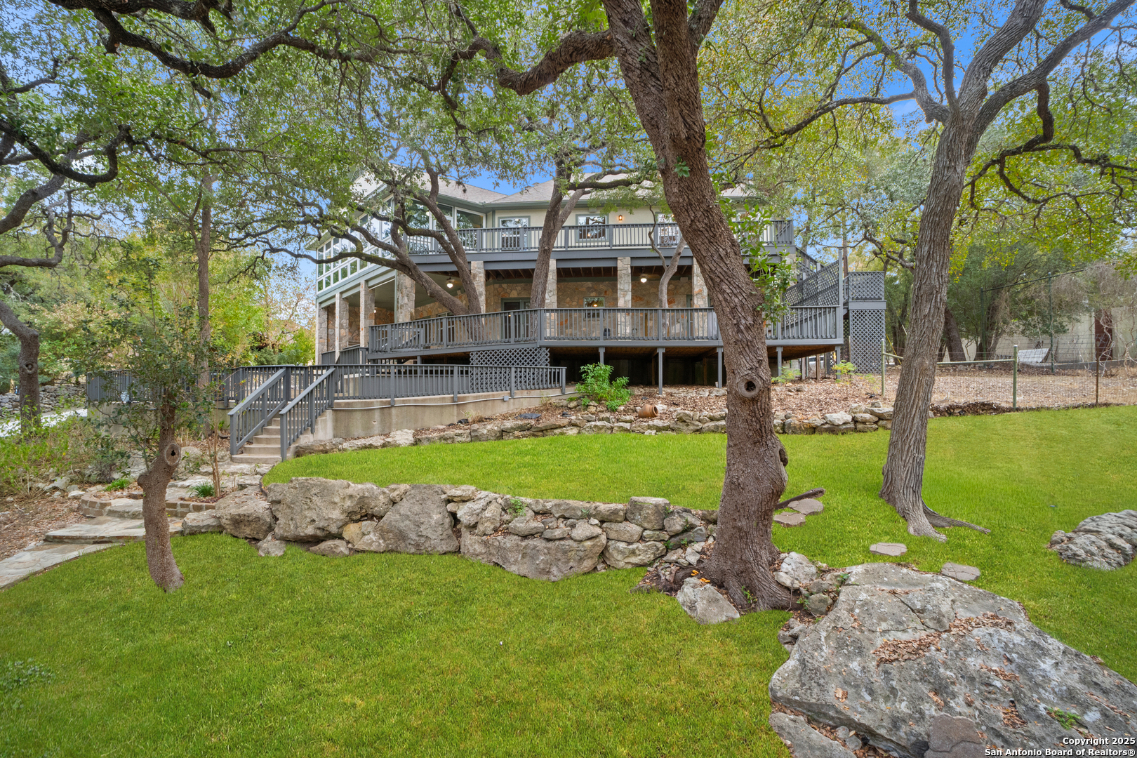 1245 Phantom Rider Trail Spring Branch, TX 78070 - Photo 48 of 51 a front view of a house with garden