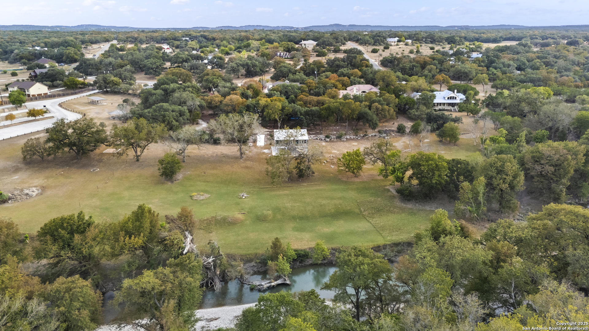 1245 Phantom Rider Trail Spring Branch, TX 78070 - Photo 49 of 51 an aerial view of residential houses with outdoor space