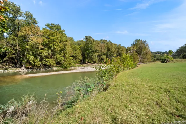 a view of a house with backyard porch and sitting area