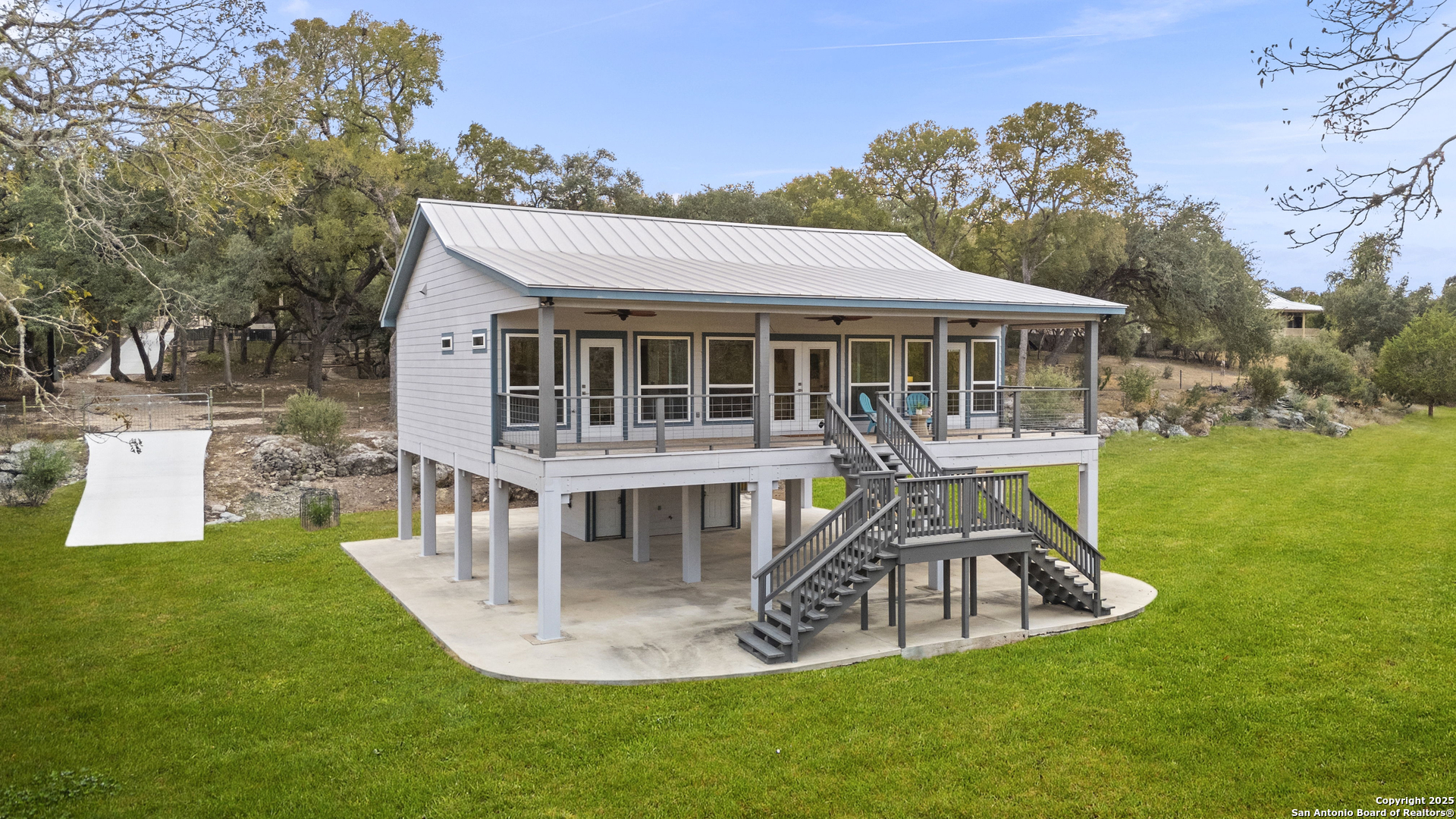 1245 Phantom Rider Trail Spring Branch, TX 78070 - Photo 6 of 51 a view of a house with backyard porch and sitting area