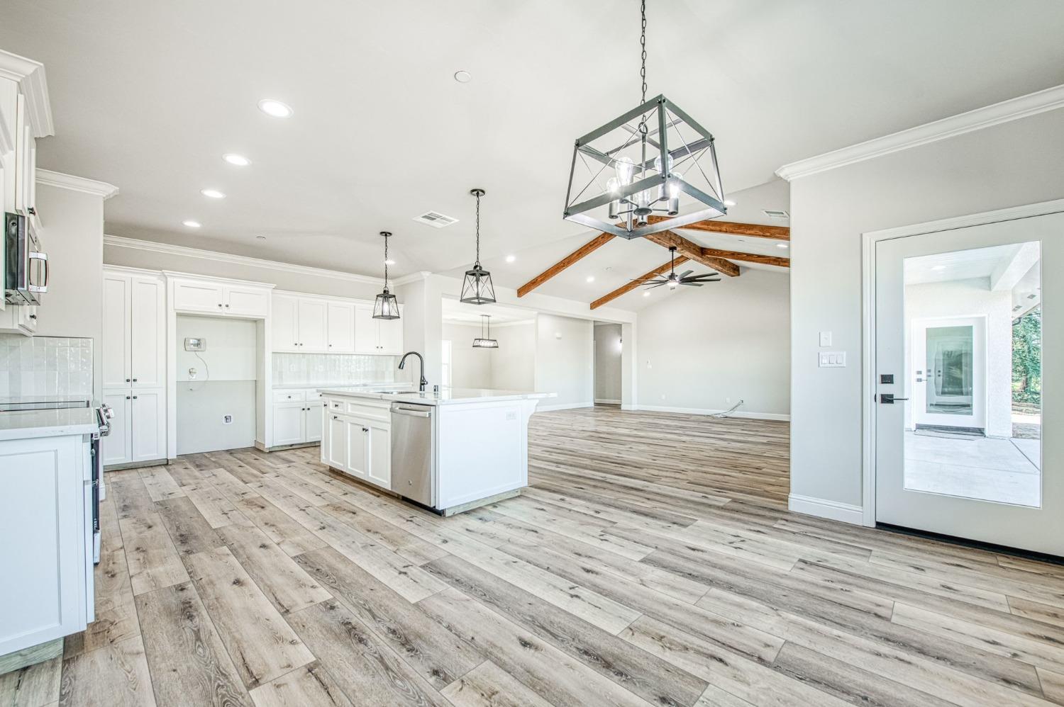 11271 Mountain View Drive Madera, CA 93636 - Photo 17 of 73 a view of a kitchen with wooden floor and a sink