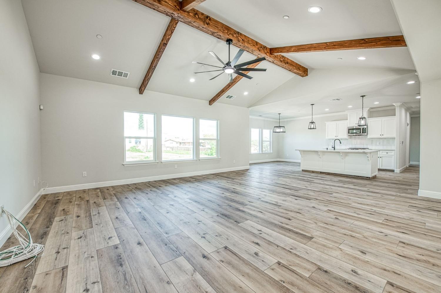 11271 Mountain View Drive Madera, CA 93636 - Photo 27 of 73 a view of kitchen and hall with wooden floor