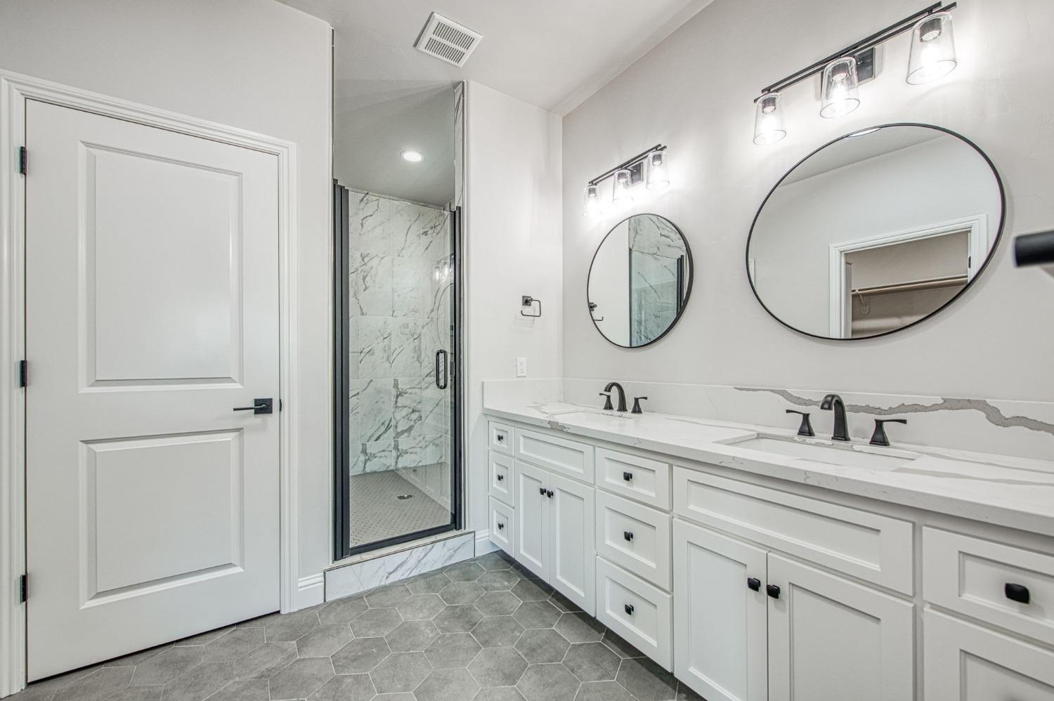 11271 Mountain View Drive Madera, CA 93636 - Photo 5 of 73 a bathroom with a double vanity sink and a mirror