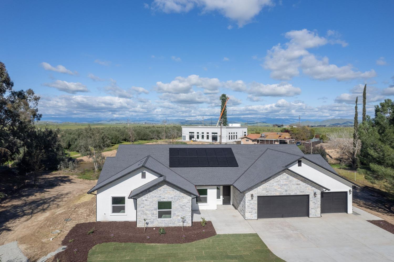 11271 Mountain View Drive Madera, CA 93636 - Photo 55 of 73 a aerial view of a house next to a yard
