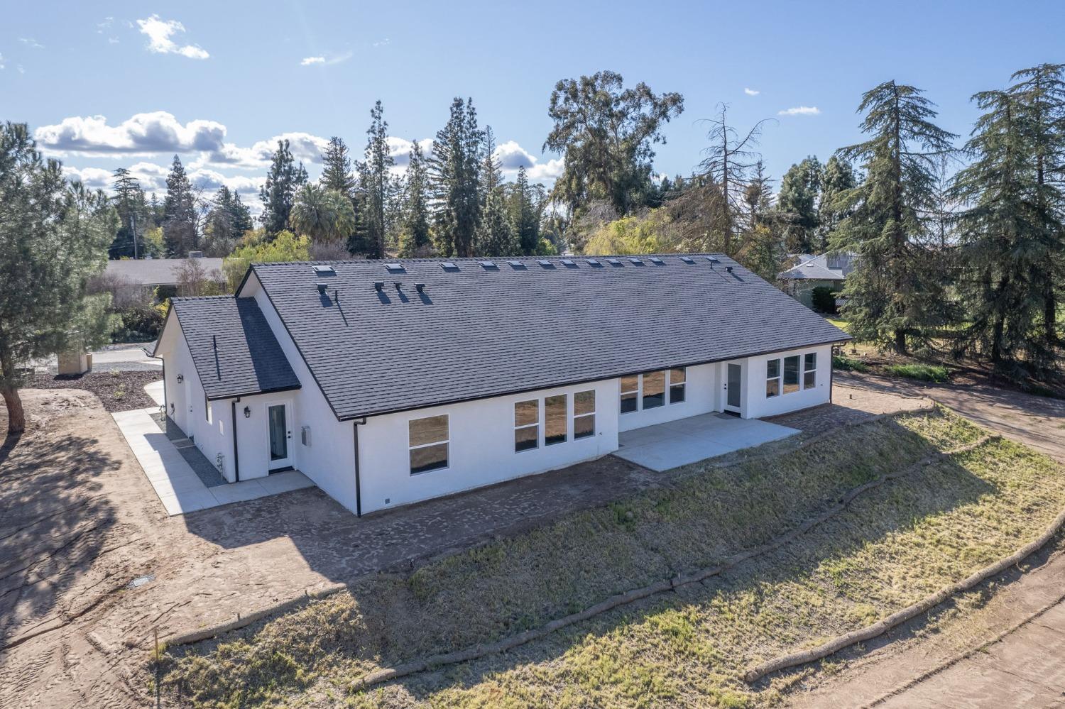 11271 Mountain View Drive Madera, CA 93636 - Photo 61 of 73 a view of a big house with a big yard plants and large trees