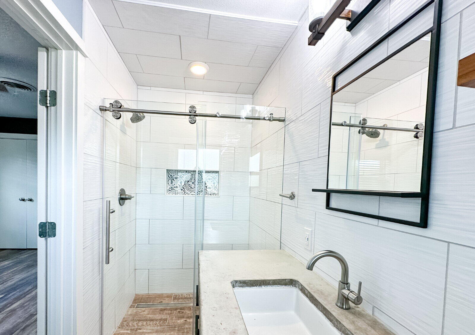 2608 Raleigh Avenue Lubbock, TX 79410 - Photo 9 of 23 a bathroom with a shower and mirror