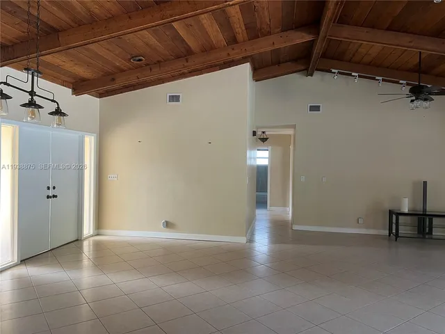 a view of a room with wooden walls