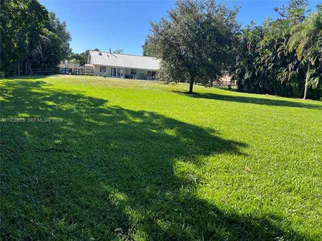 a view of a house with a big yard