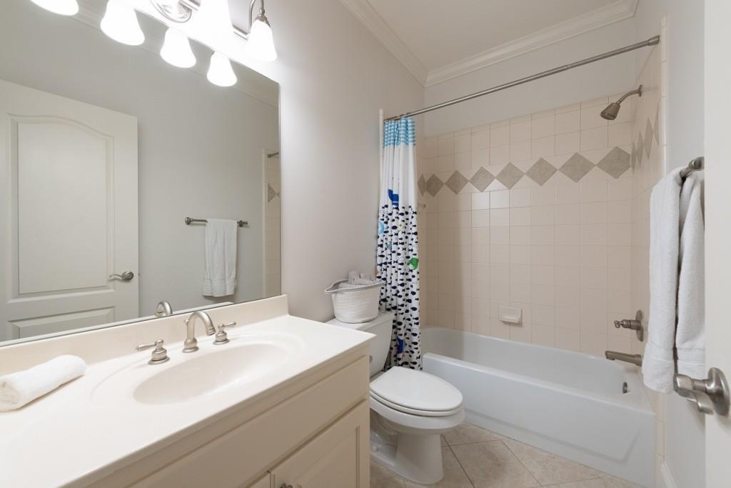 165 Autry Trail Alpharetta, GA 30022 - Photo 38 of 70 a bathroom with a sink a toilet and shower