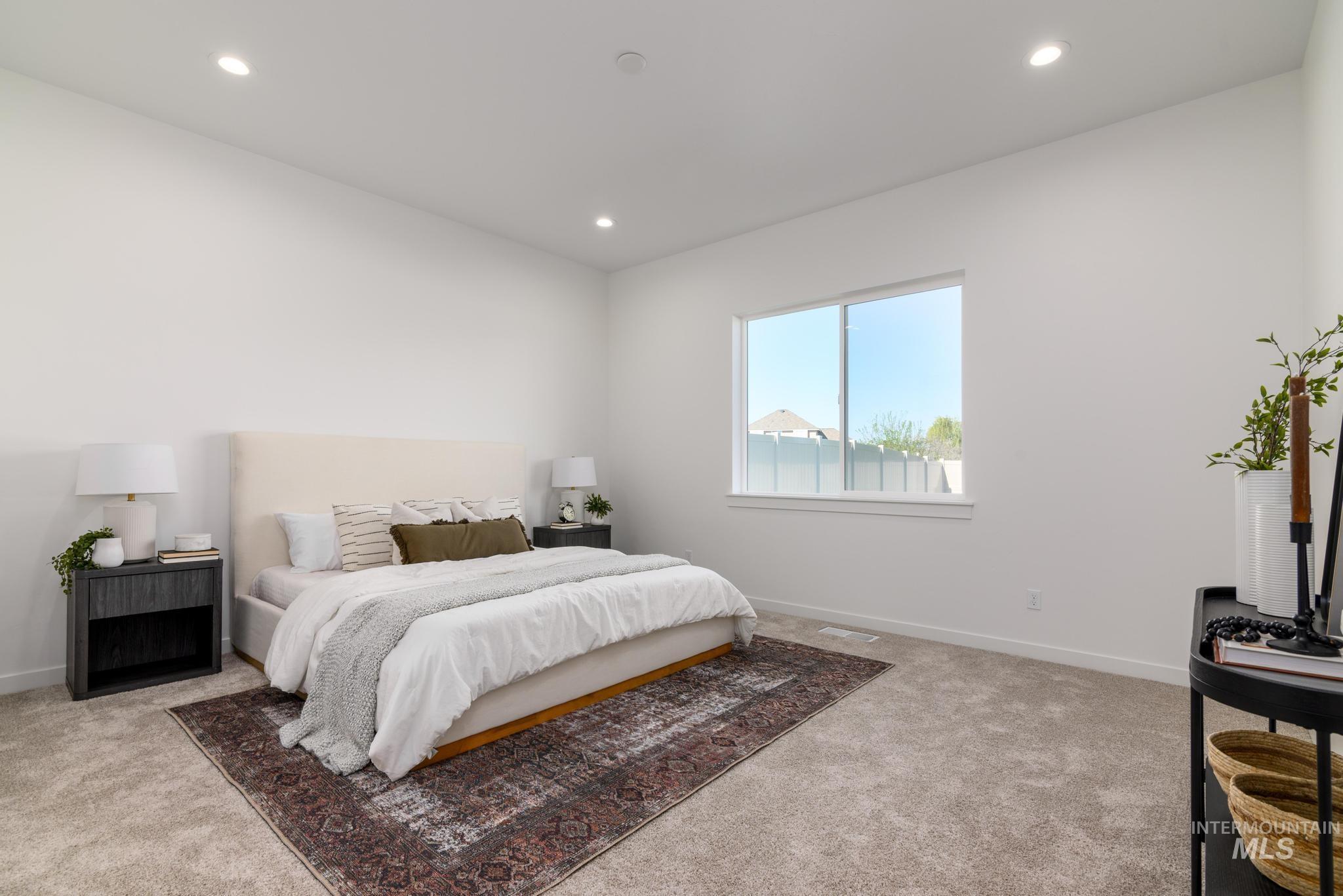 5324 Sparky Avenue Caldwell, ID 83607 - Photo 7 of 10 Bedroom with light colored carpet and recessed lighting