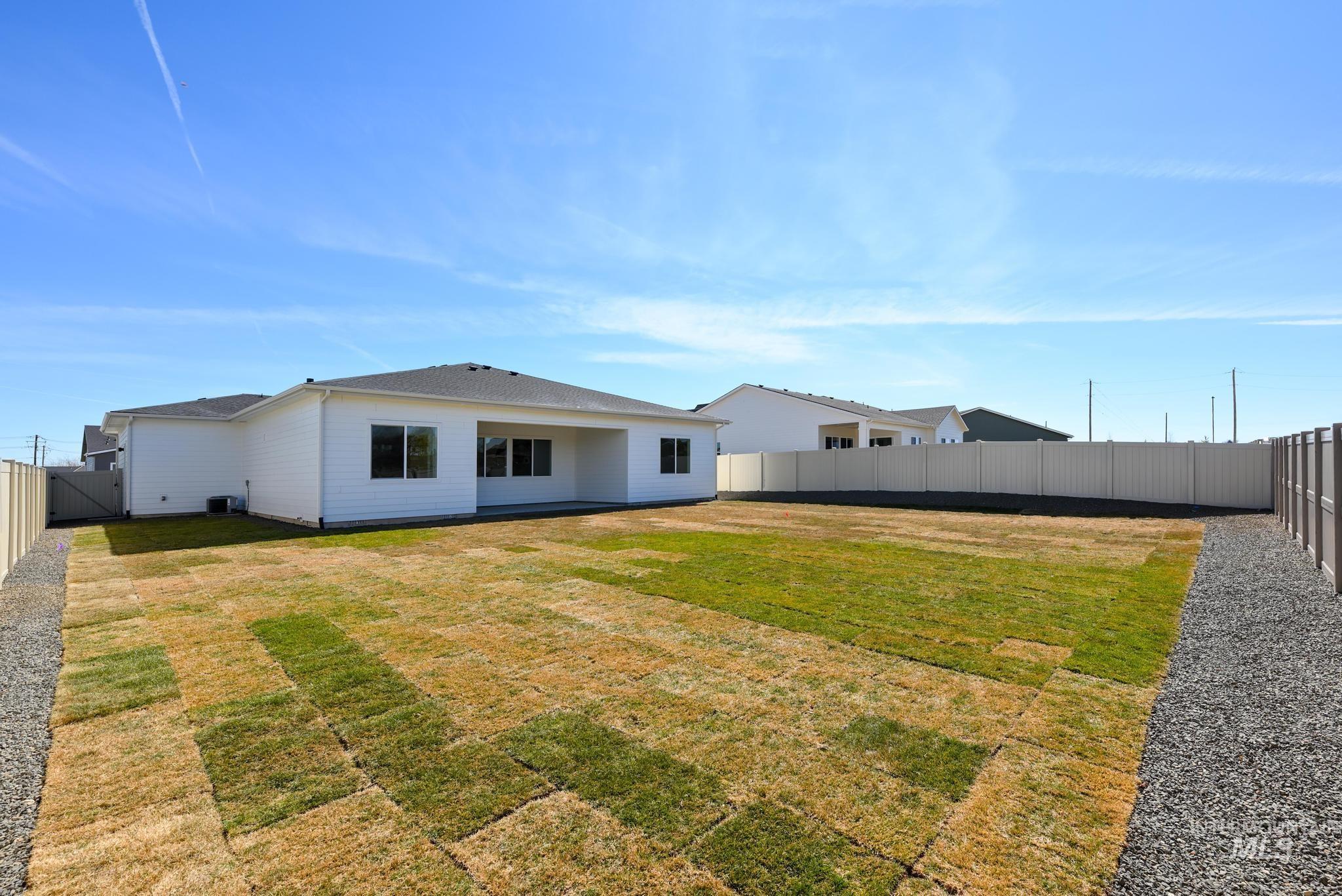 5324 Sparky Avenue Caldwell, ID 83607 - Photo 10 of 10 Rear view of property with a fenced backyard and a patio area