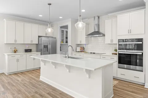 a kitchen with a refrigerator and window
