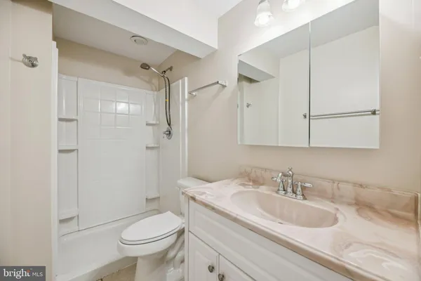 a bathroom with a shower and toilet