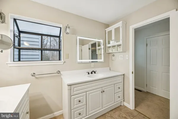 a view of a field with a snow in the background