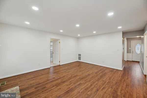 a kitchen with granite countertop stainless steel appliances and wooden cabinets
