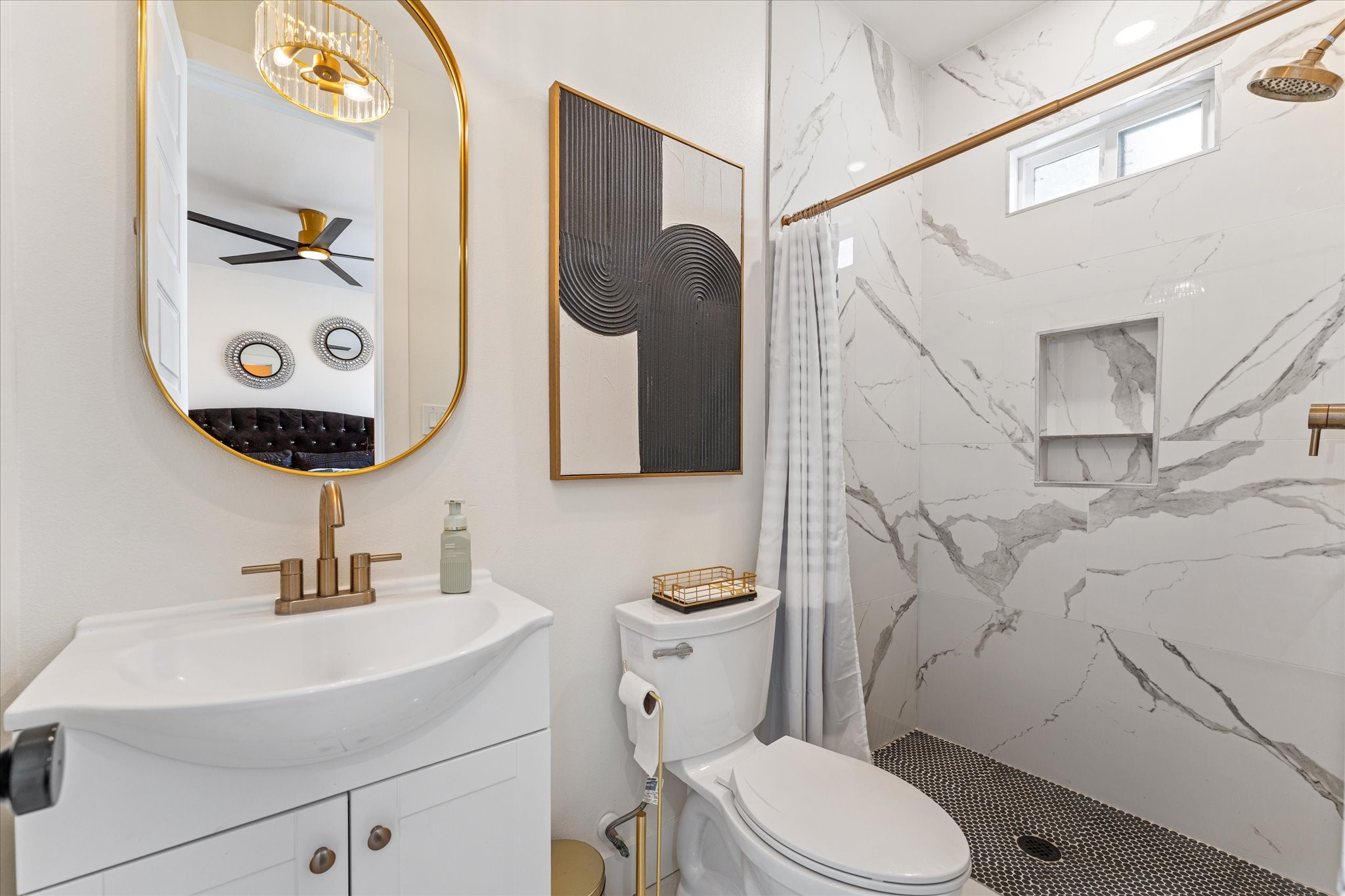 4627 County Road 63 Rosharon, TX 77583 - Photo 18 of 34 a bathroom with a toilet sink and mirror
