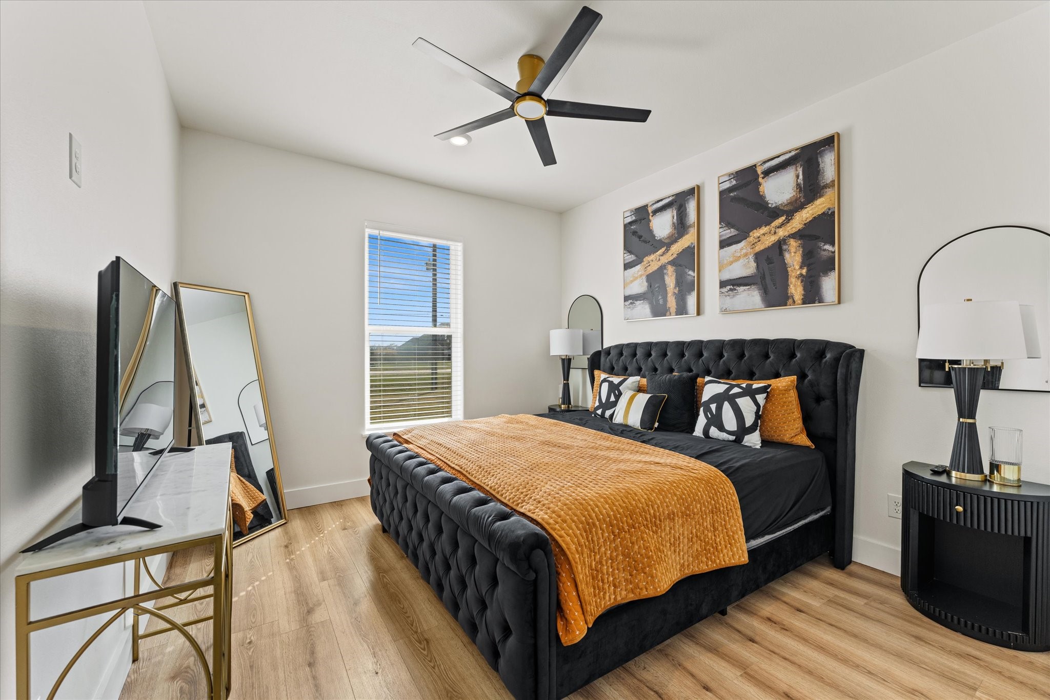 4627 County Road 63 Rosharon, TX 77583 - Photo 19 of 34 a bedroom with a bed a flat screen tv and a chandelier